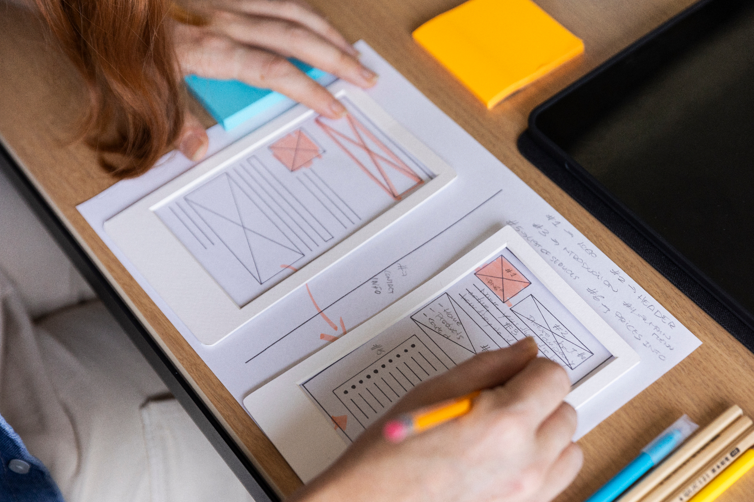 Person sketching wireframes